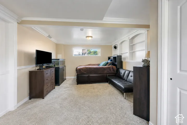 Generously sized downstairs bedroom with direct access to the adjoining bathroom—an excellent option for a second primary suite.