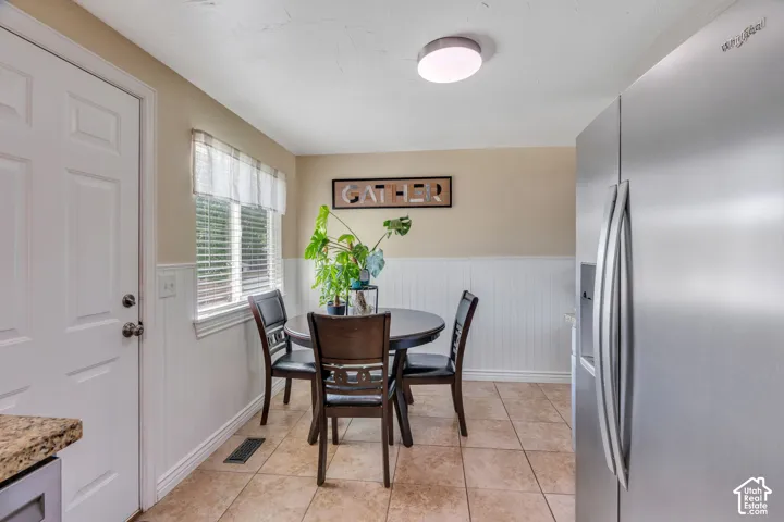 Charming eat-in dining nook creates a cozy spot for everyday meals.