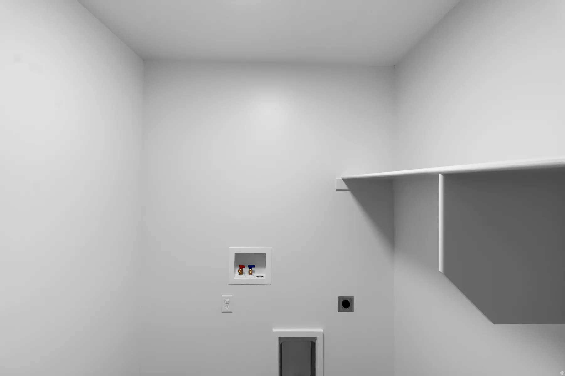 Built-in shelving, laundry hookups, and a dedicated dryer vent