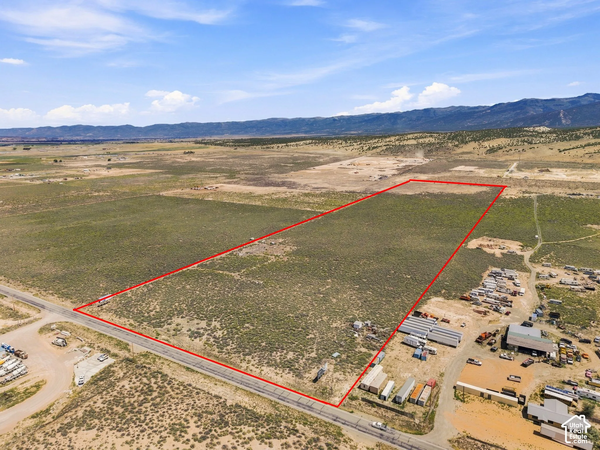 Expansive undeveloped land with a distant mountain backdrop