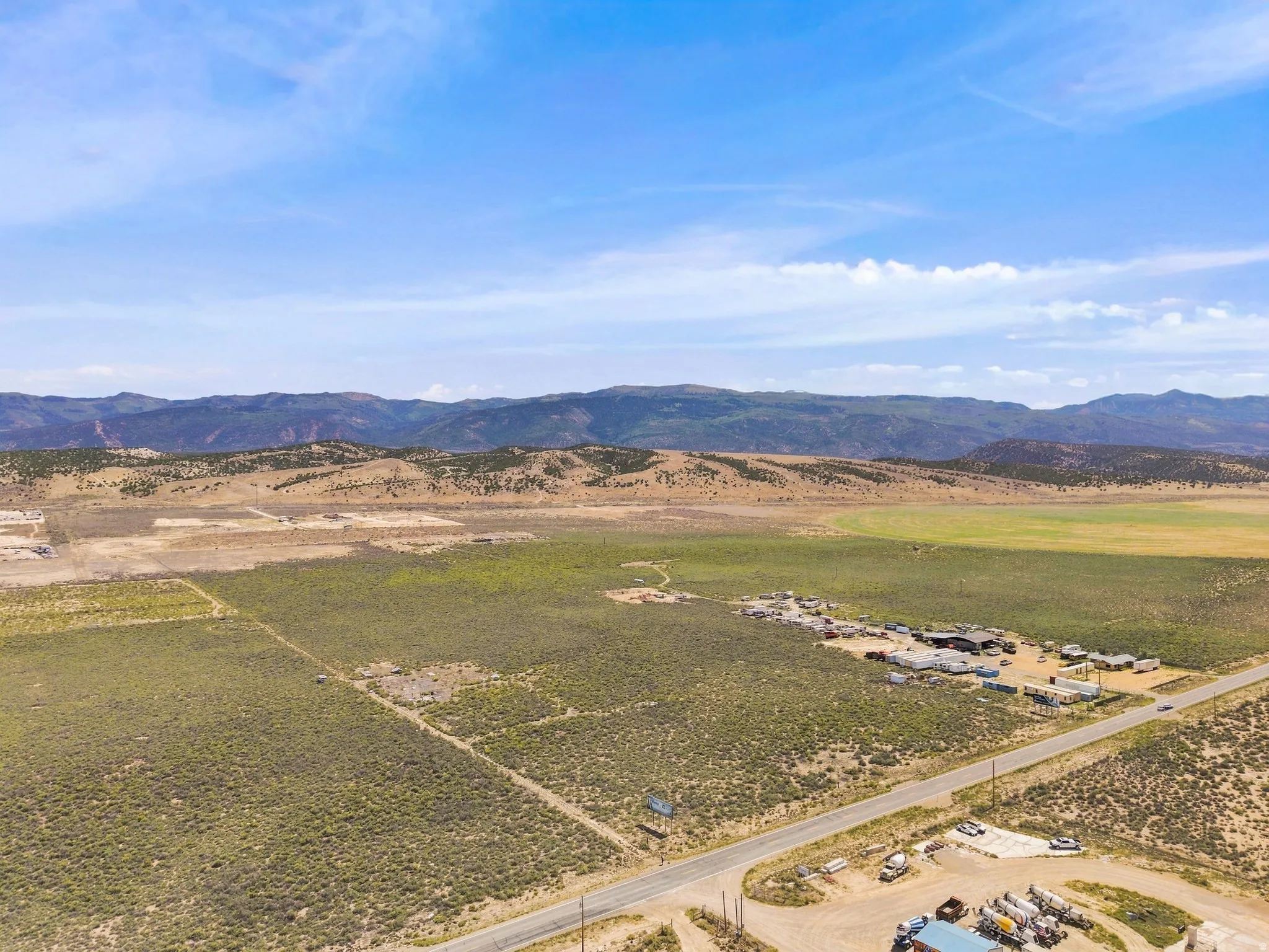 Expansive open landscape with distant mountain ranges