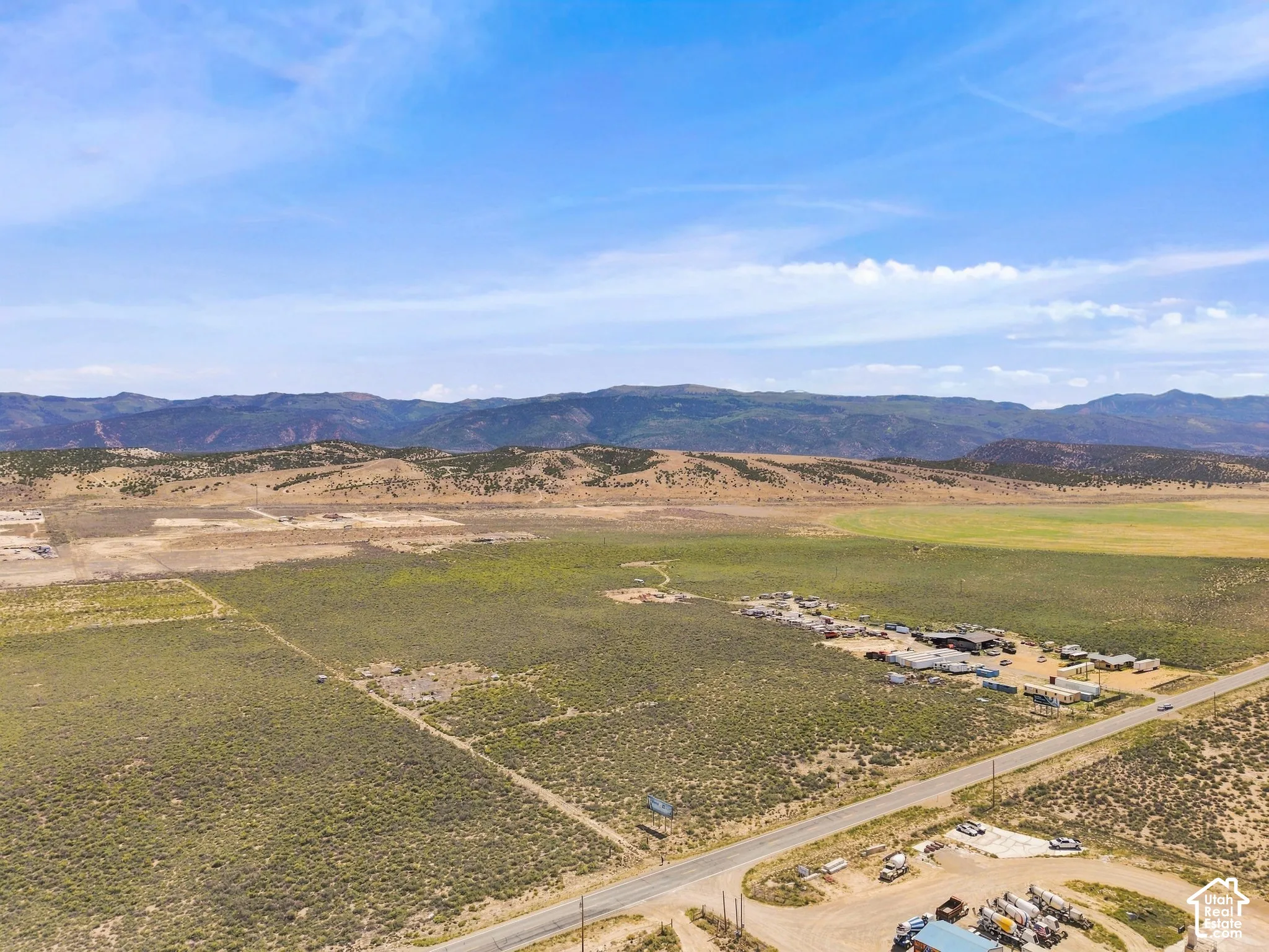 Expansive open landscape with distant mountain ranges