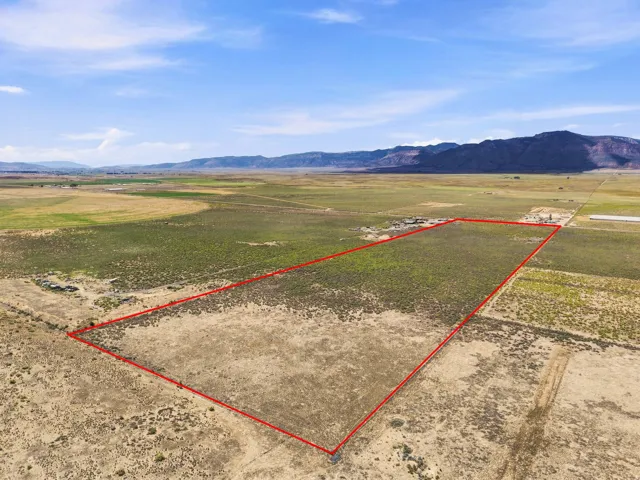 Expansive undeveloped land with a distant mountainous backdrop