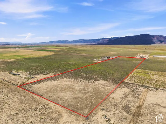 Expansive undeveloped land with a distant mountainous backdrop