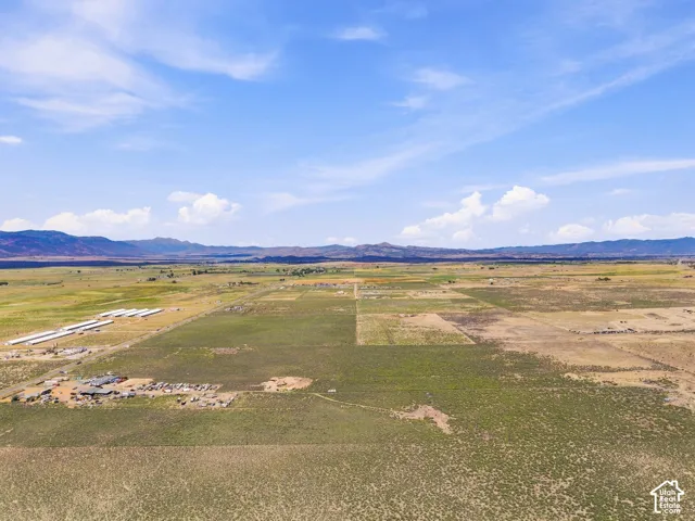 Expansive open land with distant mountain ranges
