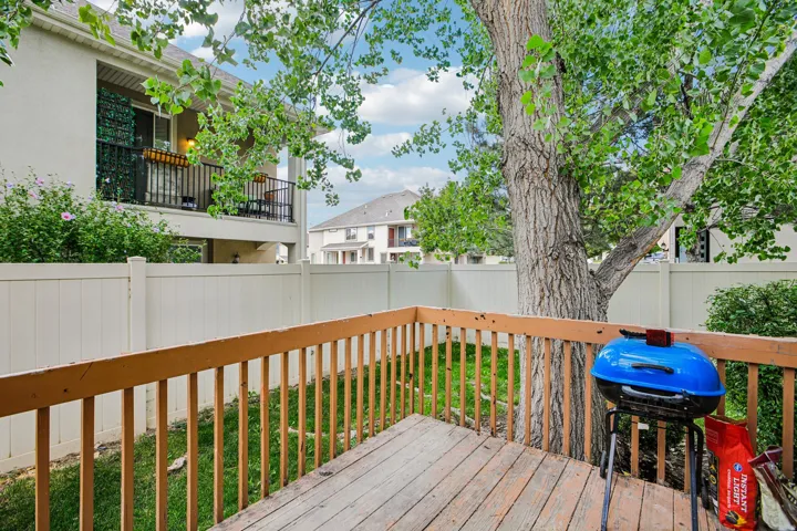 Backyard with Deck and Large Shade Tree
