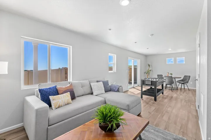 Recessed lighting, wood-finish flooring, and multiple windows