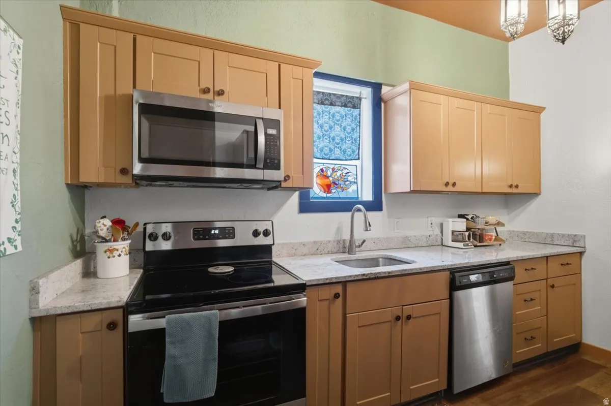 Nice kitchen space with a dishwasher and range.