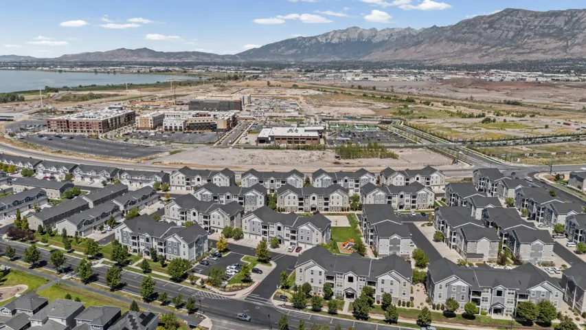 Expansive residential development featuring multi-story buildings, paved roadways, and integrated parking areas