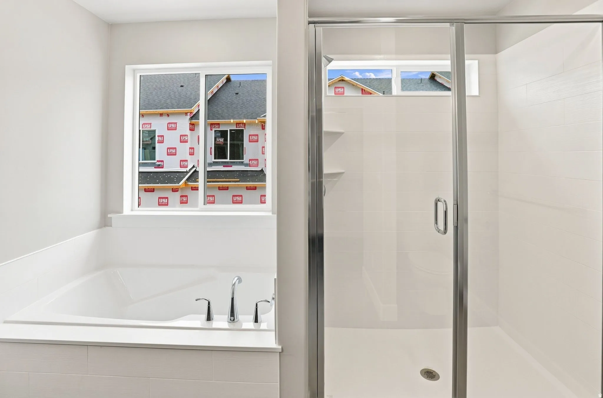 Deep soaking tub with chrome fixtures