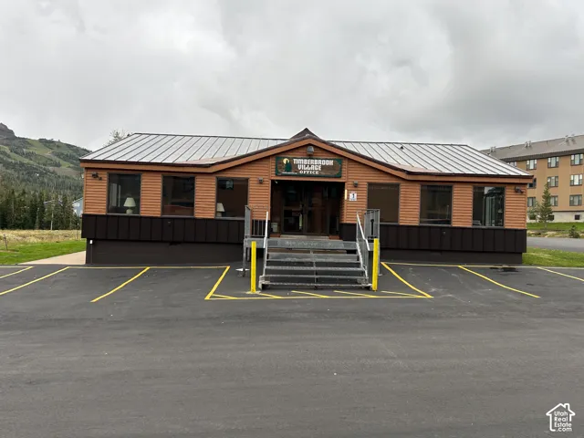 Wood-look siding exterior with a metal roof