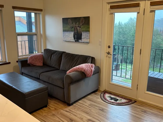Wood-finish flooring throughout, complemented by light neutral wall tones