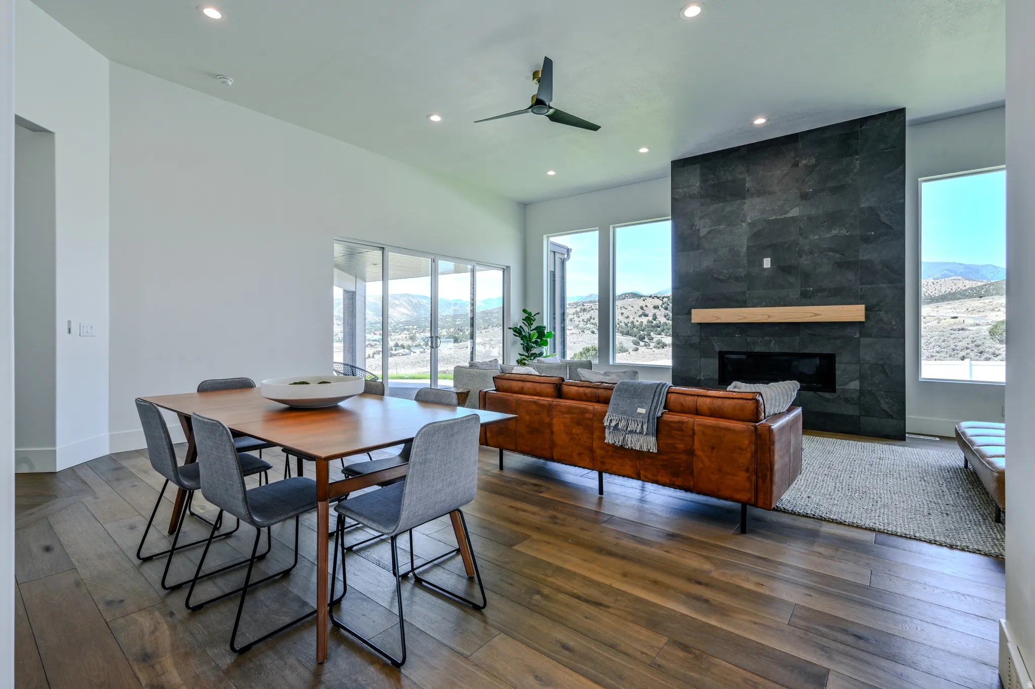 Wood-finish flooring, recessed lighting, and a modern ceiling fan