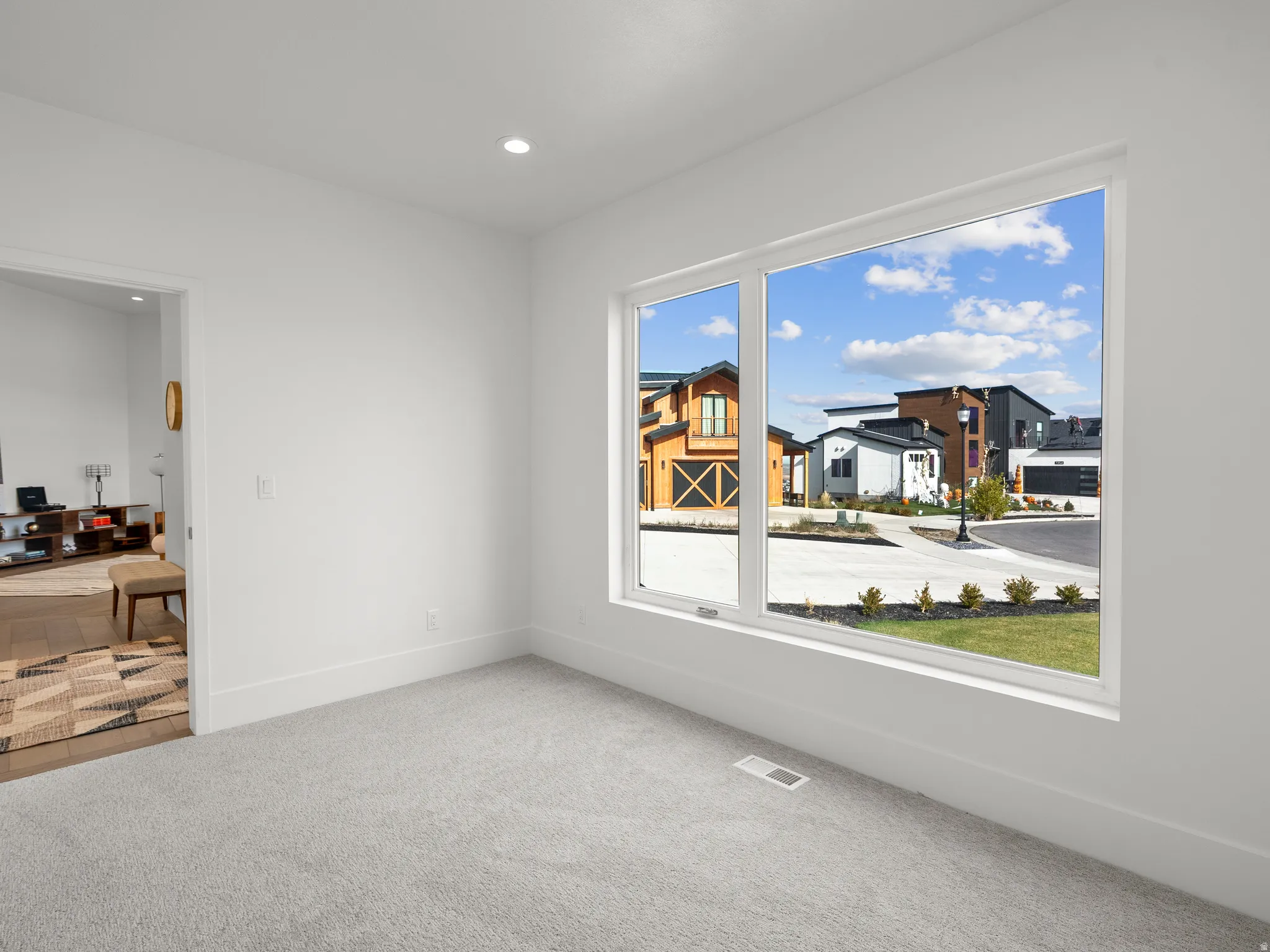Bright room with recessed lighting and a large window