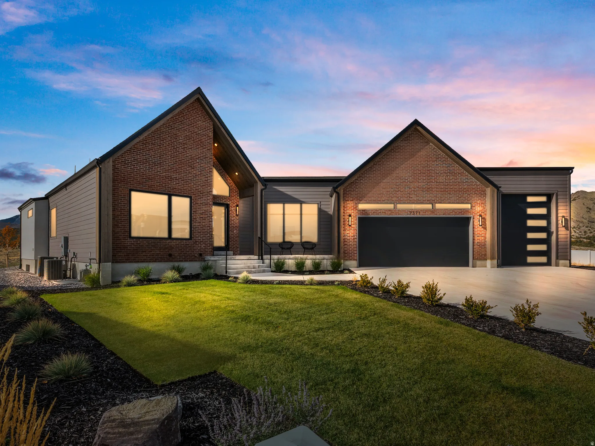 Contemporary exterior with brick and horizontal siding accents