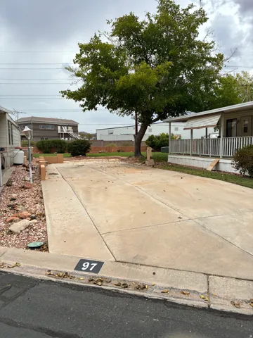 Concrete driveway with integrated curb address marker
