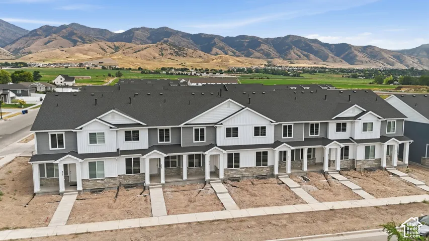 Modern townhome exteriors featuring horizontal siding and stone accents