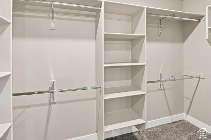 Custom closet system featuring multiple shelves and hanging rods