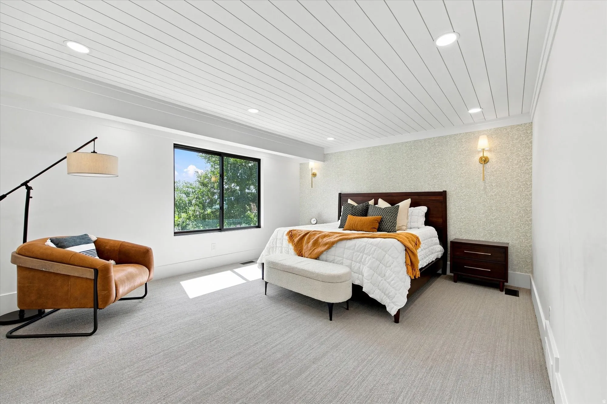 Wood-paneled ceiling with recessed lighting