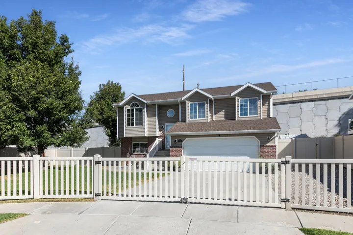 Two-story home featuring a classic architectural design with multiple gabled rooflines and dormer windows