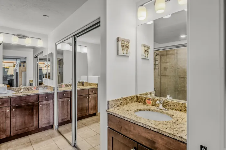 Dual vanities with granite countertops and integrated sinks
