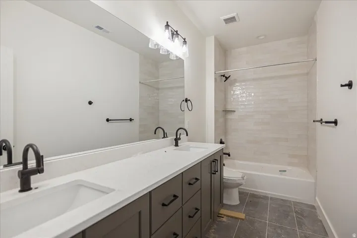 Dual sink vanity with matte black fixtures and hardware