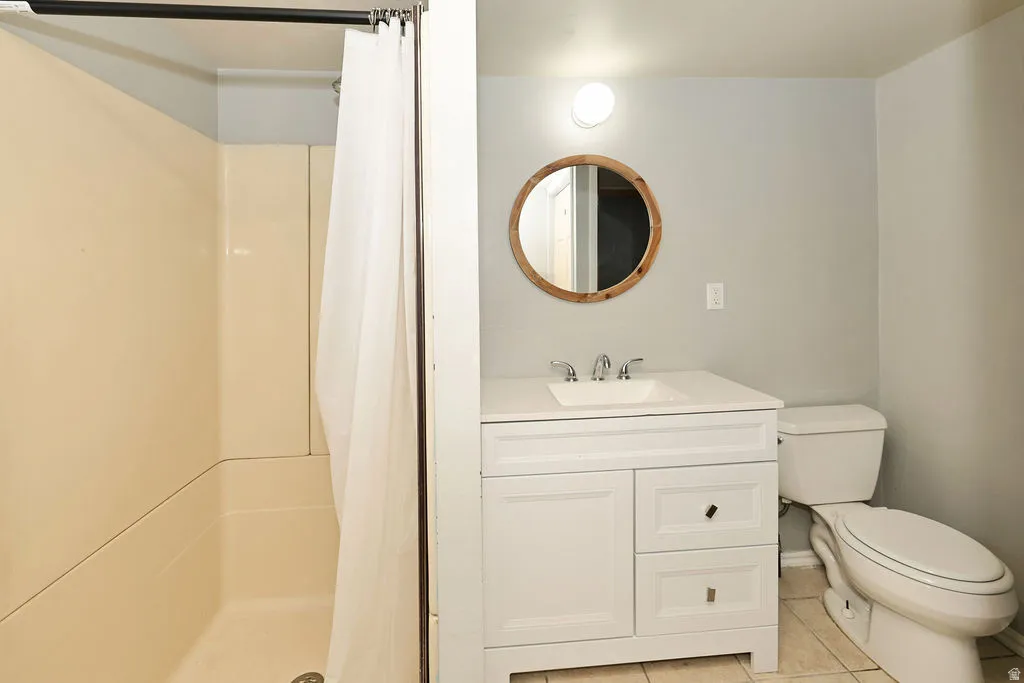 White vanity with an integrated sink and chrome fixtures