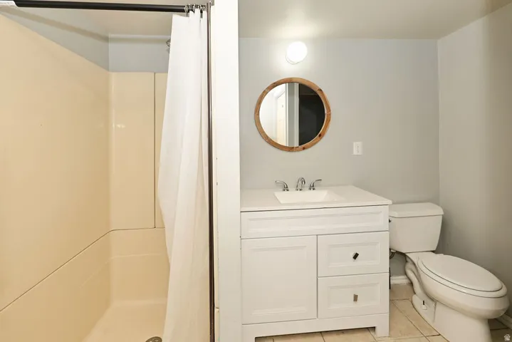 White vanity with an integrated sink and chrome fixtures