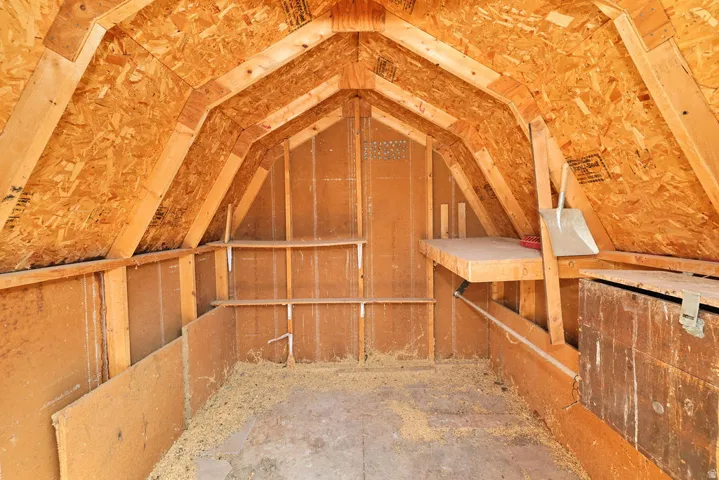Vaulted ceiling construction with exposed wood framing