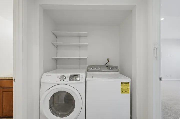 Laundry closet with shelving