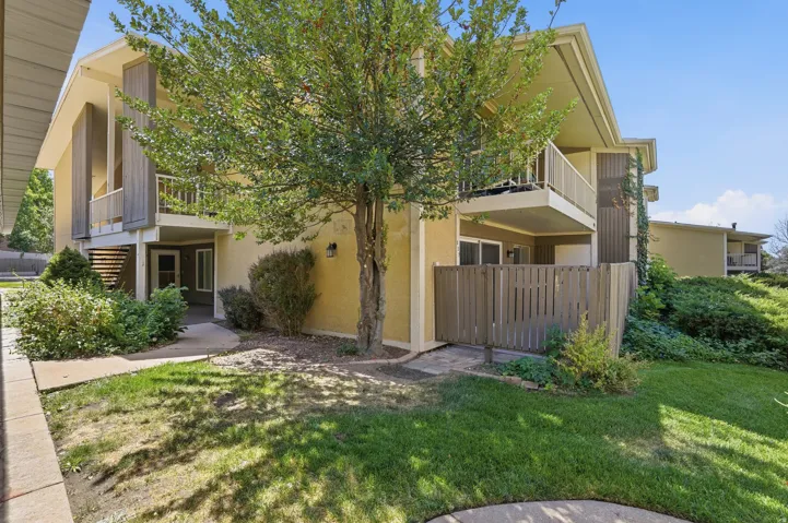 Stucco exterior with wood siding accents