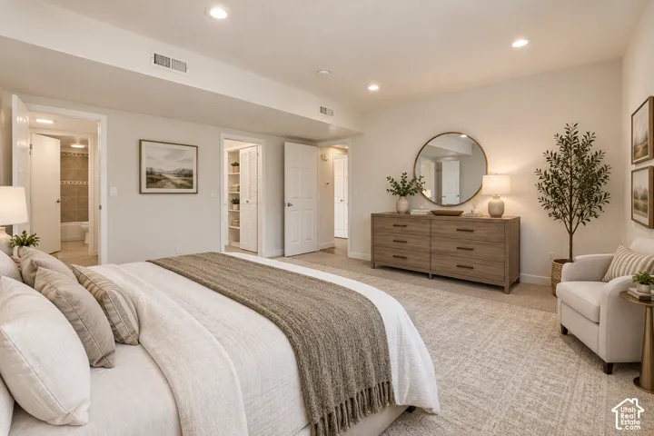 Neutral-toned interior featuring wall-to-wall carpeting, recessed ceiling lighting, and multiple interior six-panel doors