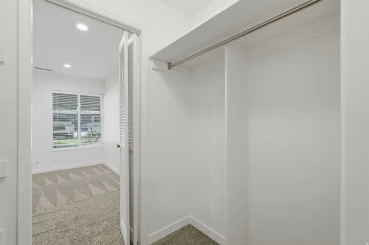 White-painted walls and trim with recessed lighting