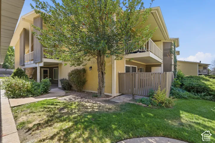 Stucco exterior with wood siding accents
