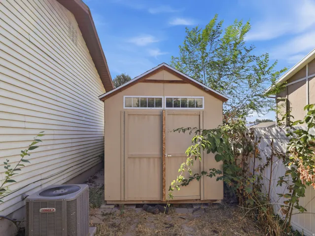 Utility shed featuring dual doors and transom windows