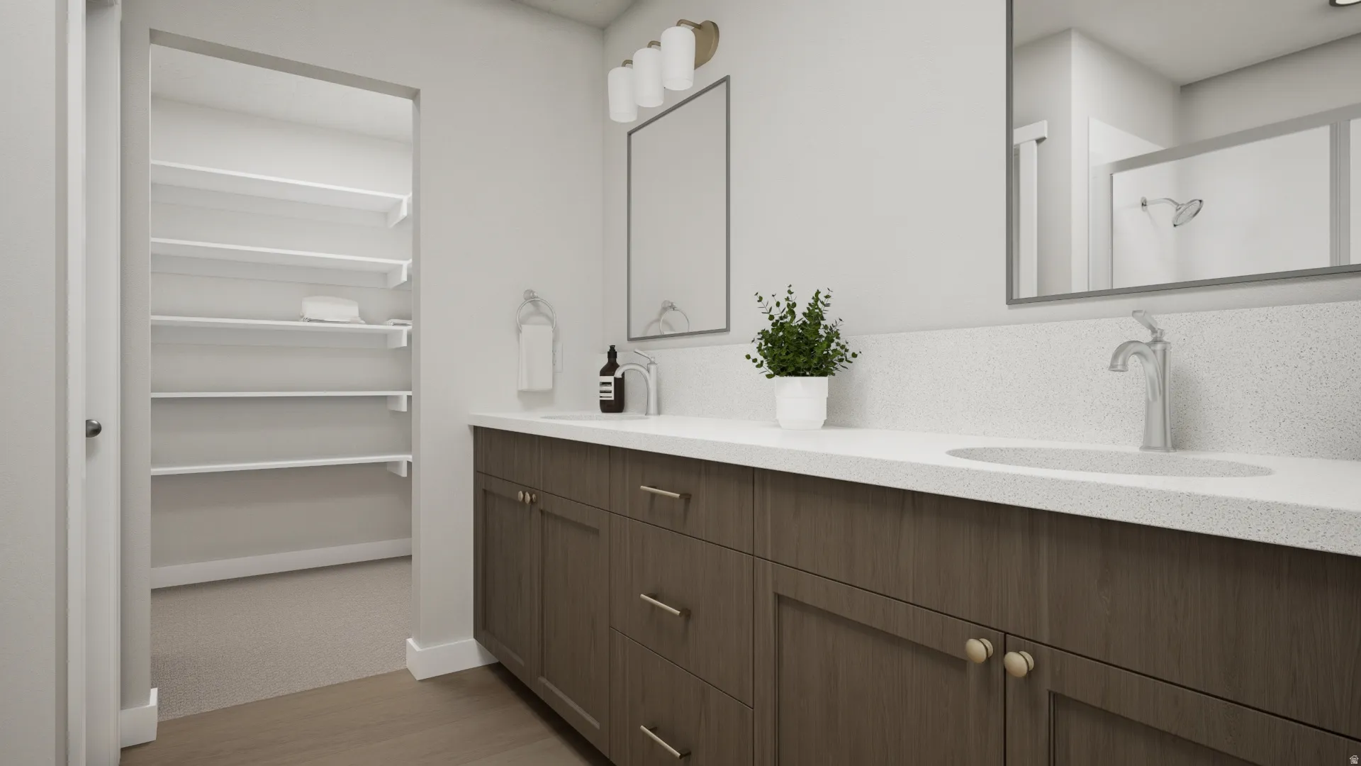 Dual vanity with integrated sinks, chrome fixtures, and a white countertop