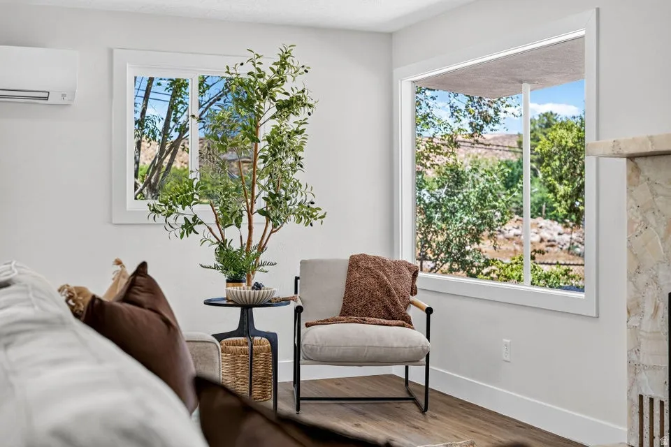 Bright interior with dual pane windows and wood-finish flooring