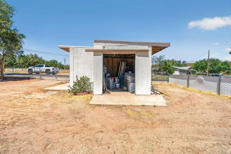 Standalone storage shed with a sloped roof design