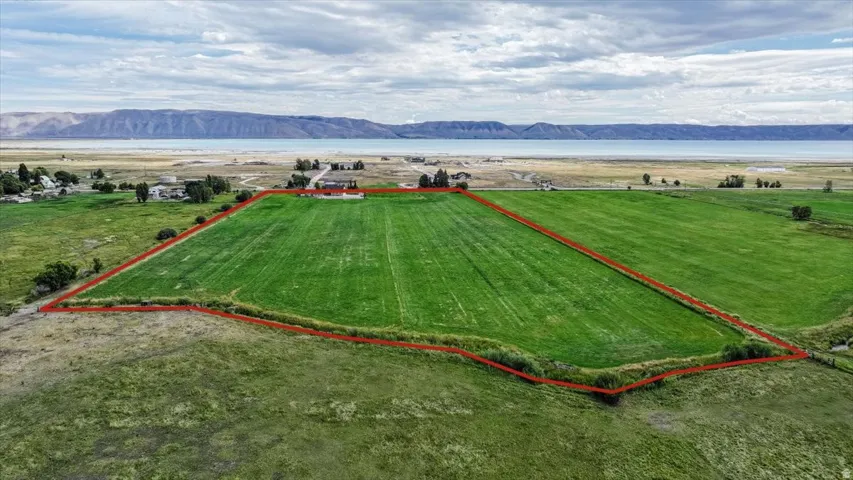 Expansive green parcel with defined property boundaries