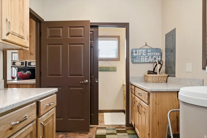 Wood cabinetry with stone-finish countertops