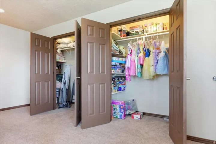 Built-in closet system with shelving and hanging rods