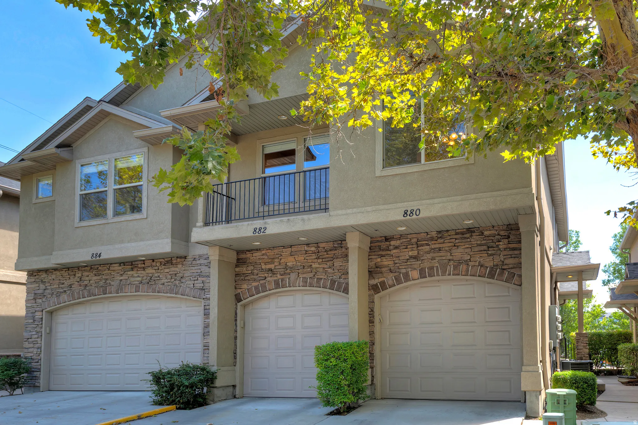 Stucco exterior with stone veneer accents