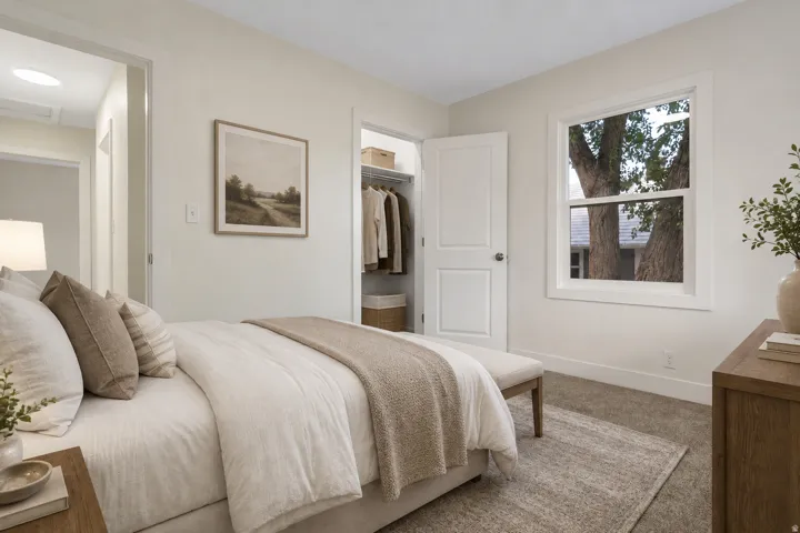 Bedroom 1 - Virtual staging. None of the items are in the room.