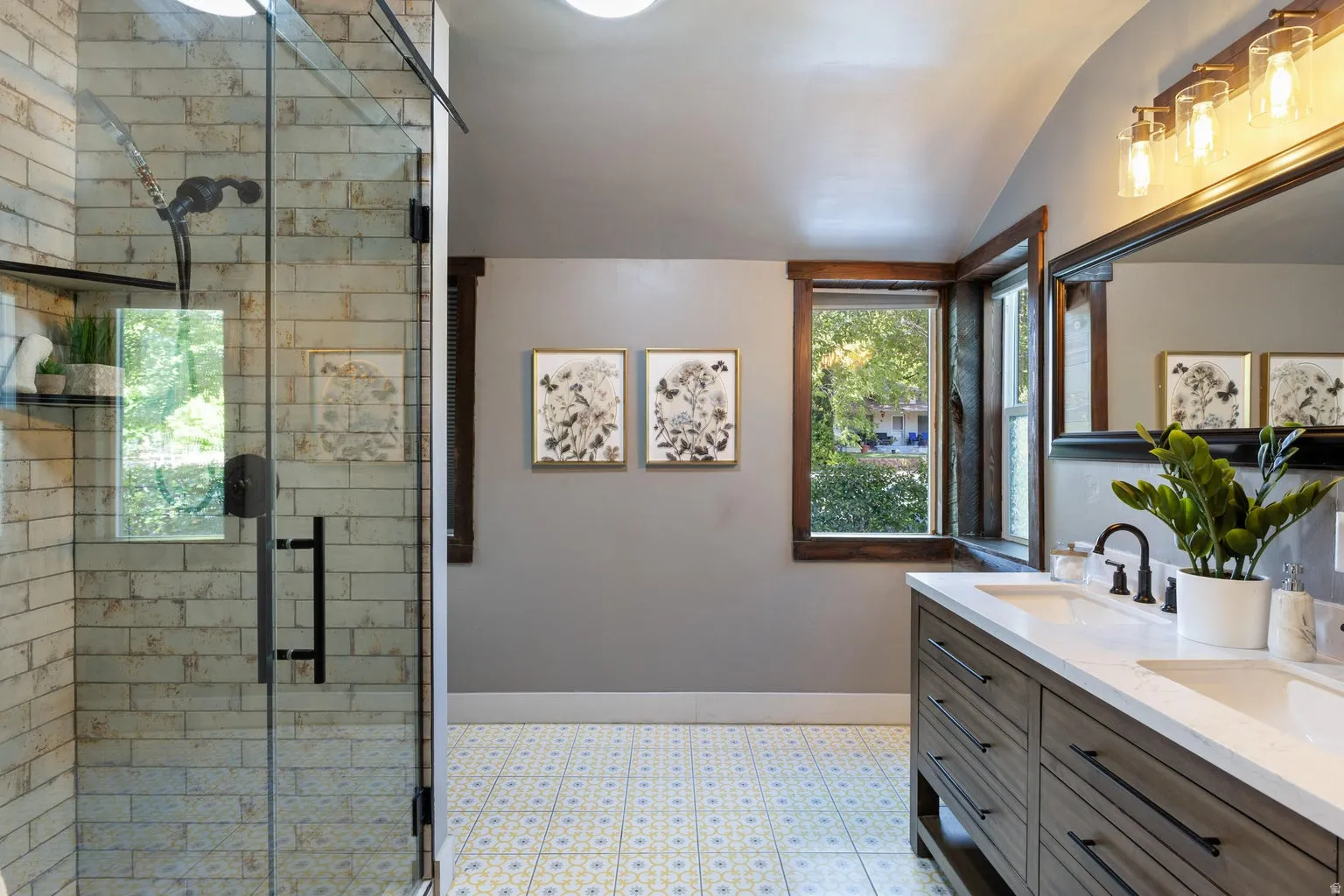 Dual-sink vanity with matte black fixtures and white countertops