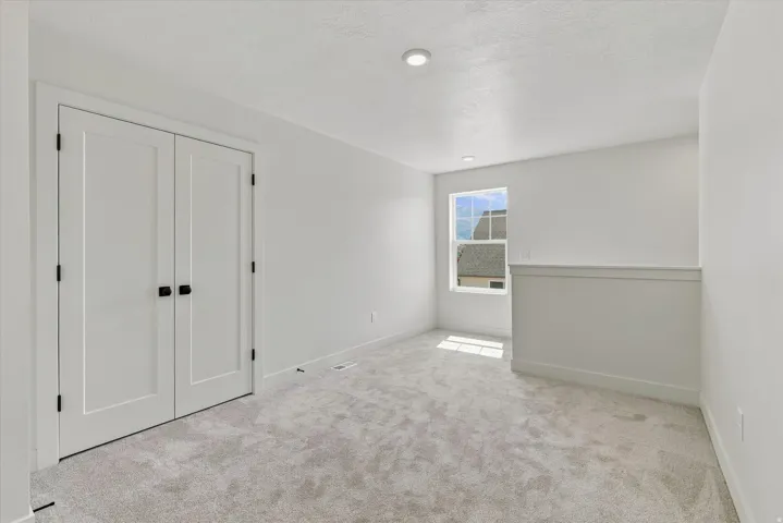 Light gray carpeting and white walls