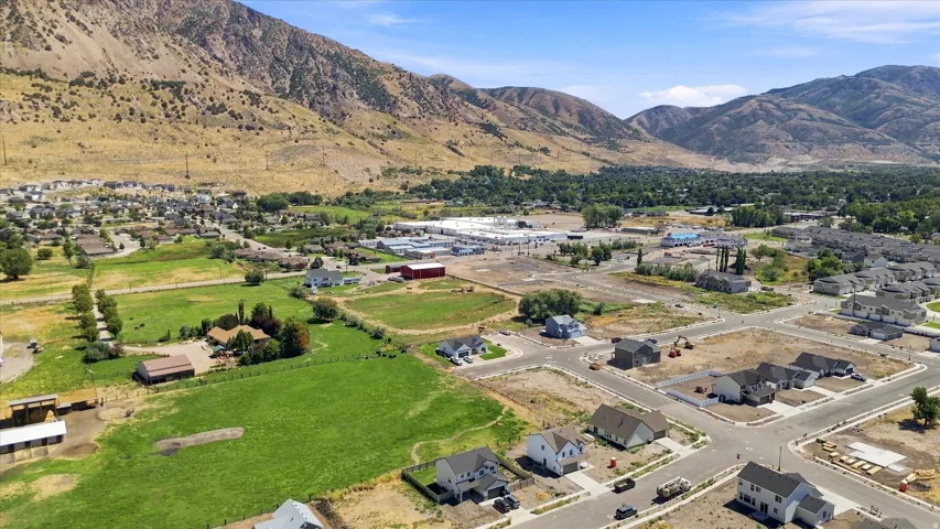 Expansive residential development featuring newly constructed homes and undeveloped lots