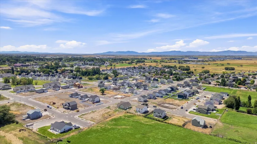 Developing residential area featuring numerous single-family homes and undeveloped lots