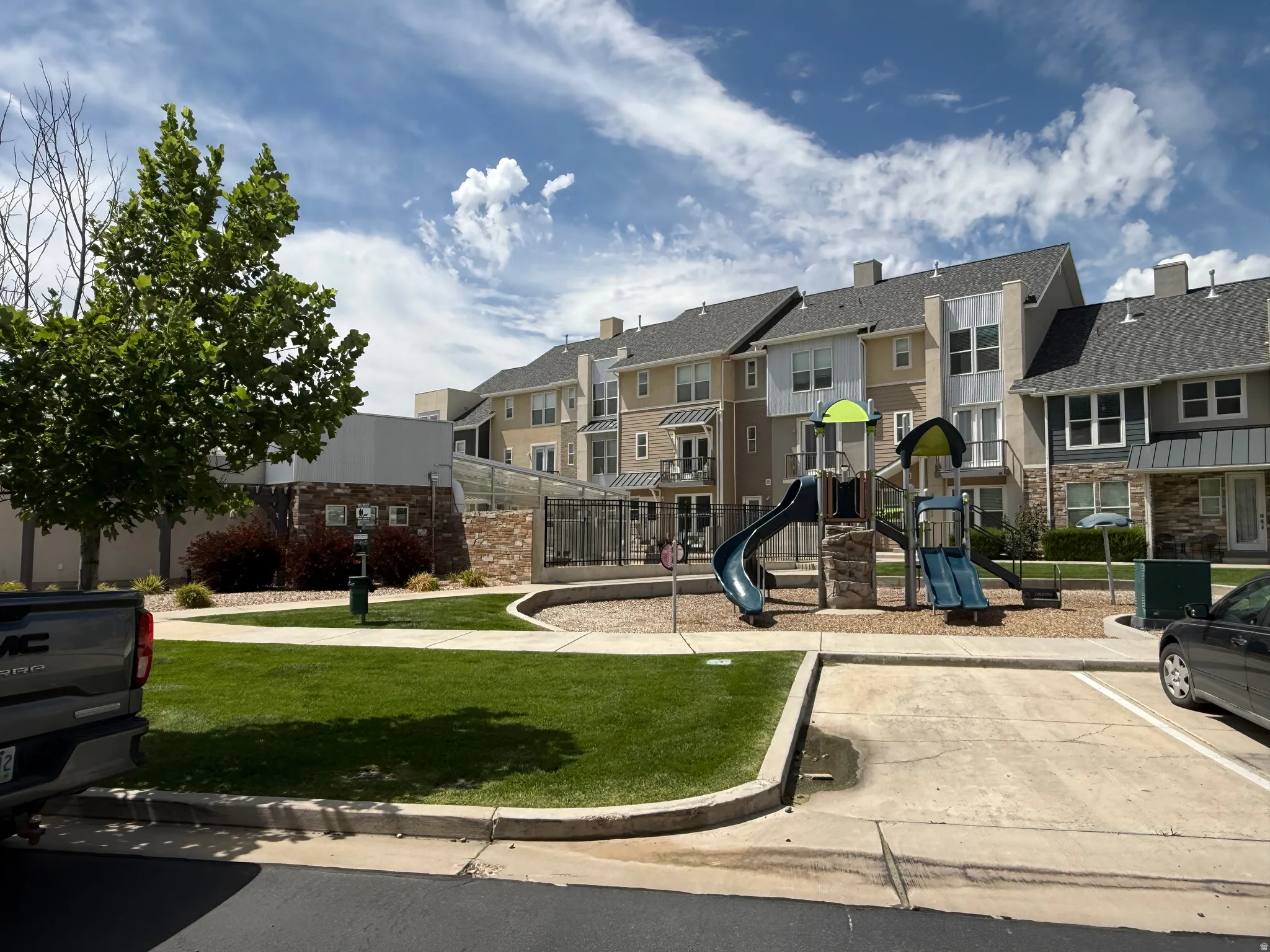 Community playground featuring multiple slides and climbing structures