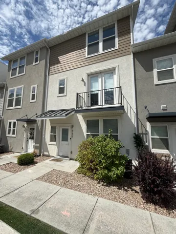 Multi-level stucco exterior with horizontal siding accents