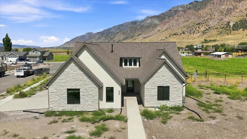 Modern exterior design with stone veneer and stucco finishes